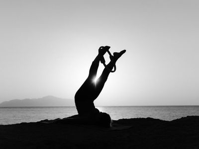 Abstract yoga pose in silhouette