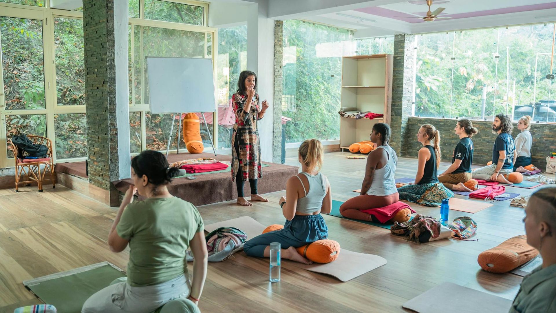 Serene person practicing yoga in a bright studio environment